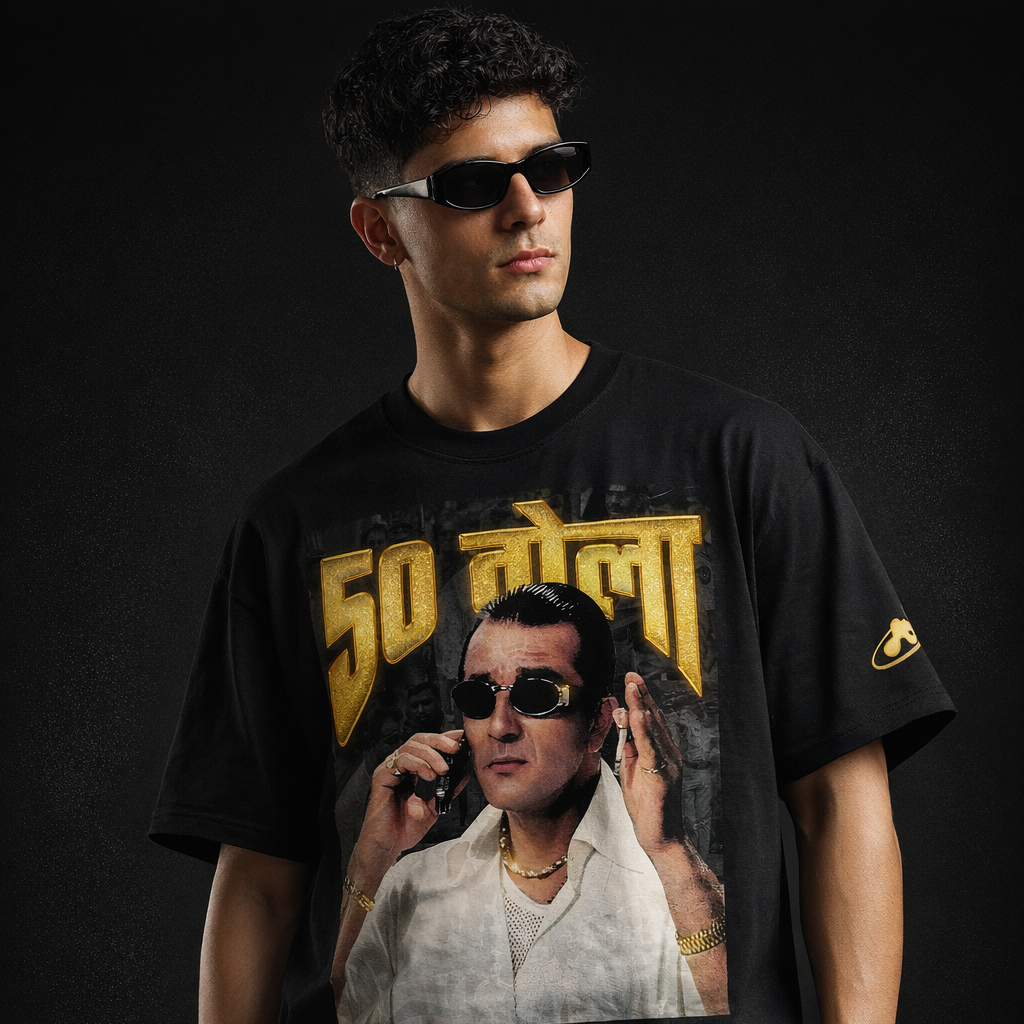 Person wearing a black t-shirt with a graphic design on a dark background